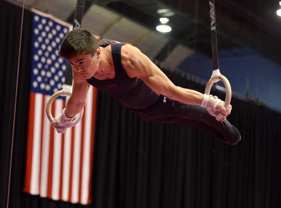 Coach Jon competing on rings